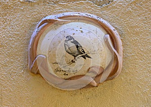 Bird Painting on outside wall Le Bar des Oiseaux, on a narrow backstreet in old town, Nice, France photo