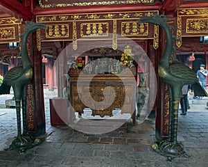 Bronze cranes on turtles in front of Buddhist altar, House of Ceremonies, Temple of Literature, Hanoi, Vietnam