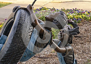 Backyard Adventure by Missy Vandable, bronze sculpture in Edmond, Oklahoma