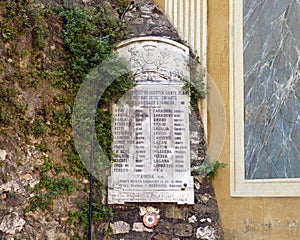 Closeup of memorial to left of Chapelle de la Visitation Sainte-Claire at the foot of Castle Hill in Nice, France