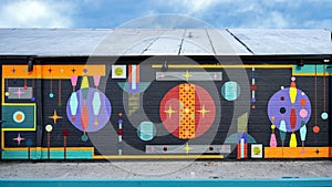 Colorful, fun abstract wall mural by unidentified artist on a building in Dallas, Texas.