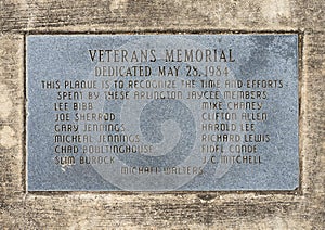 Dedication plaque for a granite obelisk memorial honoring all Veterans in Vandergriff Park in the City of Arlington, Texas.