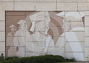 Distinctive wall mural featuring a student graduating along Interstate 30 in Arlington, Texas. photo