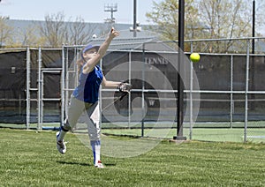 Girl softball pitcher warming up before a game photo