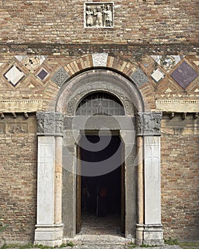 Entrance portal, front facade of the Church of the Saints Vitale and Agricola on Saint Stephen Square in Bologna, Italy.