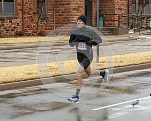 Forty-nine year old man running the Edmond Turkey Trot on Thanksgiving in Edmond, Oklahoma