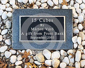 Information plaque, marble sculpture titled `15 Cubes` by Marton Varo on the campus of Texas Christian University in Fort Worth.