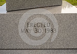 Inscription base of granite obelisk memorial honoring all Veterans in Vandergriff Park in the City of Arlington, Texas.