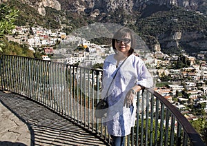 Korean woman on holiday on the way to Positano, a village and comune on the Amalfi Coast, in Campania, Italy. photo