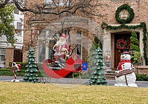 Christmas display on a lawn in Dallas, Texas, with Santa and Frosty the Snowman. photo