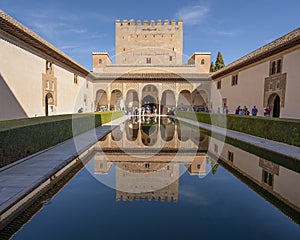 Long, rectangular reflecting pool in the Courtyard of the Myrtles of the Comares Palace in the Alhambra in Granada, Spain.