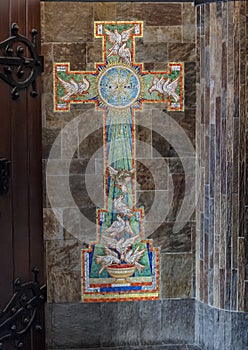 Pictured is a mosaic cross with white doves, Amsterdam, The Netherlands