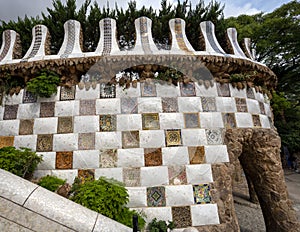 Mosaic tiled wall flanking entry staircase to Park Guell in Barcelona, Spain.. photo