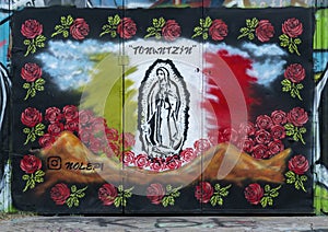 Mural featuring `Our Lady of Gaudalupe` surrounded by roses at the Fabrication Yard in Dallas, Texas.