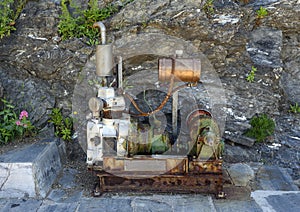 Old engine and drive train on display in Manarola, the second smallest of the famous Cinque Terre towns, Italy photo