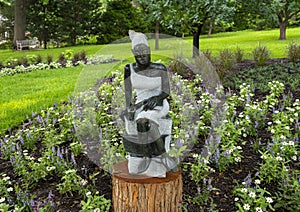 Opal stone sculpture titled Bookreader by Jonothan Mhondorohuma in the Fort Worth Botanic Garden.