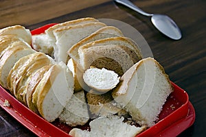 Sliced white bread on the old table.