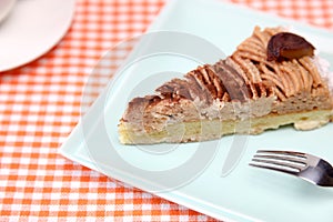 A piece of chestnu cake on a dish