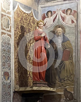 Statue titled 'Virgin Annunciate' by Jacopo della Quercia in the Colegiata di Santa Maria Assunta in San Gimignano. photo