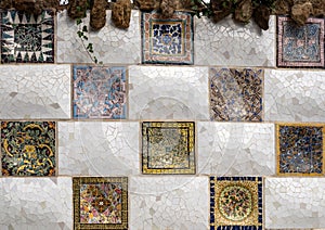 Portion of a mosaic tiled wall flanking entry staircase to Park Guell in Barcelona, Spain.. photo