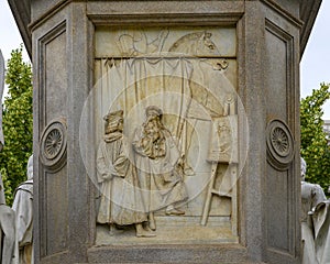 Sculpting relief front of the Monument to Leonardo Da Vinci in Piazza della Scala Square, Milan, Italy.