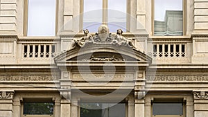 Sculpture of Mercury and Larunda on a building in Milan, Italy