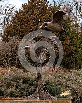 `Settling In` by Fred Boyer at the entrance to Sugar Hill residential district in Edmond, Oklahoma on Route 66.