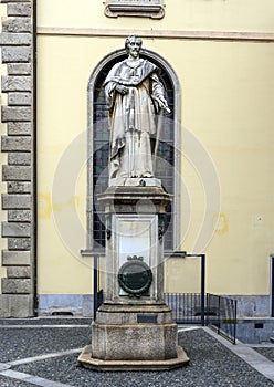 Statue of Cardinal Federico Borromeo outside The Pinacota Ambrosiana, the Ambrosian art gallery in Milan, Italy photo