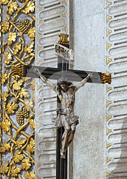 Statue of Jesus nailed to the cross inside the Sanctuary of Our Lady of Nazare, Portugal. photo