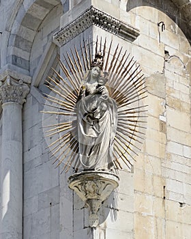 Statue of the Madonna salutis portus by Matteo Civitali on the facade of San Michele in Foro in Lucca, Italy. photo