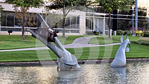 Giant fish eating a house by Joe Barrington, Hall Park, Frisco, Texas