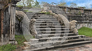 Stone dragon statues on the steps to the terrace of the garden of the Forbidden city, Imperial City, Citadel, Hue, Vietnam photo