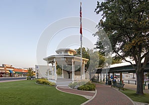 Town Square Gazebo with flagpole in the historic district of Grapevine, Texas .