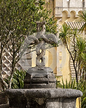 Stone cross at The Pena Palace, a Romanticist Castle in Sao Pedro de Penaferim, in Sintra, on the Portuguese Riviera. photo