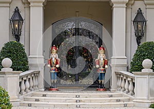 Two Nutcrackers guarding the door of a mansion in Highland Park at Christmas in Dallas County, Texas photo