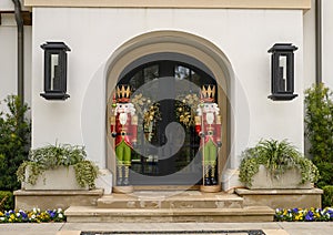 Two Nutcrackers guarding the door of a mansion in Highland Park at Christmas in Dallas County, Texas photo