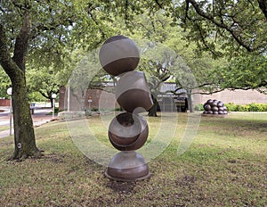 `Descending Spheres` and `Malthusian Conception` in front of the Lakewood Library in Dallas, Texas. photo