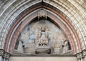 Tympanum with the Saviour flanked by Our Lady and Saint John at the West entrance to the Basilica De Santa Maria Del Mar. photo