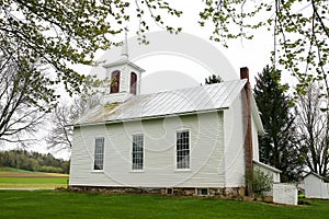 Pictureque Historic Little White Church sitting in Countryside