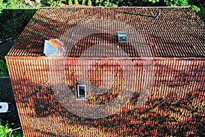 Pictures of the inspection and control of the chimney and the roof of a single family house with a drone, aerial photograph