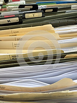 A pictures of many office files in a file cabinet