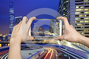 Pictures on mobile smart phone in Night view traffic in Hong Kong at sunset time