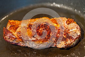 Pictures of a sliced fresh rump  steak with fat on the steak in a pan, which the steak cooks through in high heat