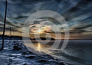 Pictures of a sunset on the frozen Baltic Sea near the Finnish town of Rauma