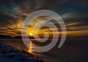 Pictures of a sunset on the frozen Baltic Sea near the Finnish town of Rauma