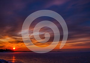 Pictures of a sunset on the frozen Baltic Sea near the Finnish town of Rauma