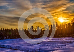 Pictures of a sunset over a forest near the Finnish town of Rauma