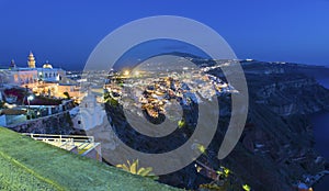 Picturesque aerial panoramic view on the town of Fira and the surrounding area at night . Santorini (Thira) island