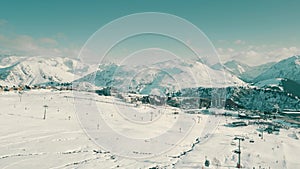 Picturesque aerial view of crowded Alpe d'Huez ski resort during high season, France photo