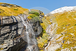 Picturesque Alpine waterfall, Grossglockner High Alpine Road in Austrian Alps.